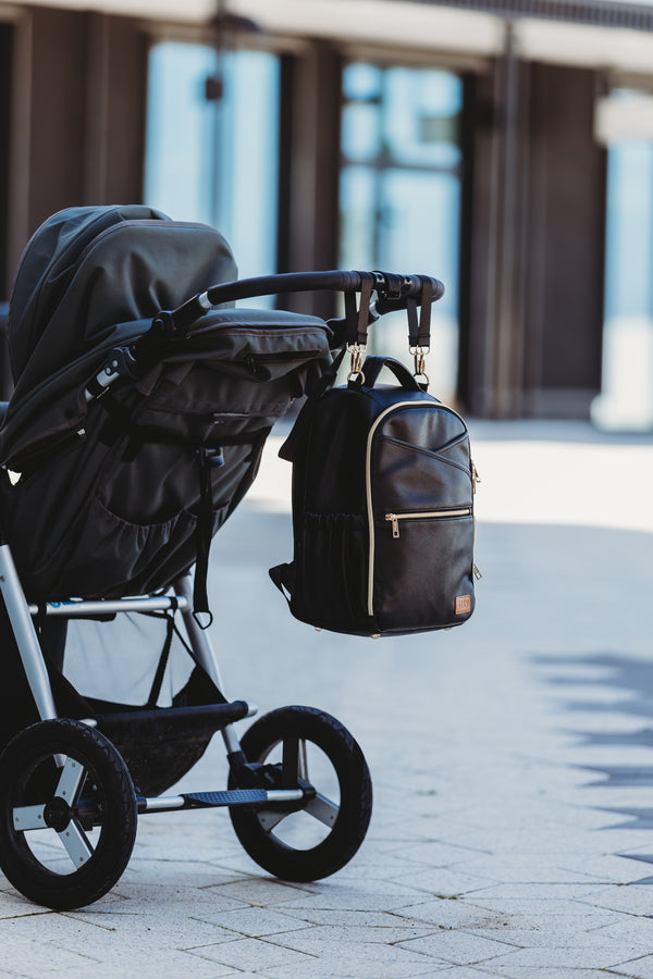 Small Espresso backpack attached to a stroller